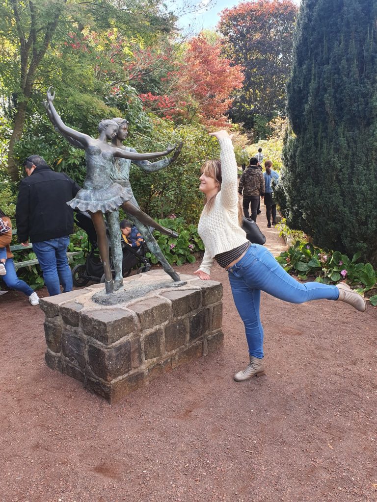 Posing with Ballerina statue hiking at Forest Glades garden