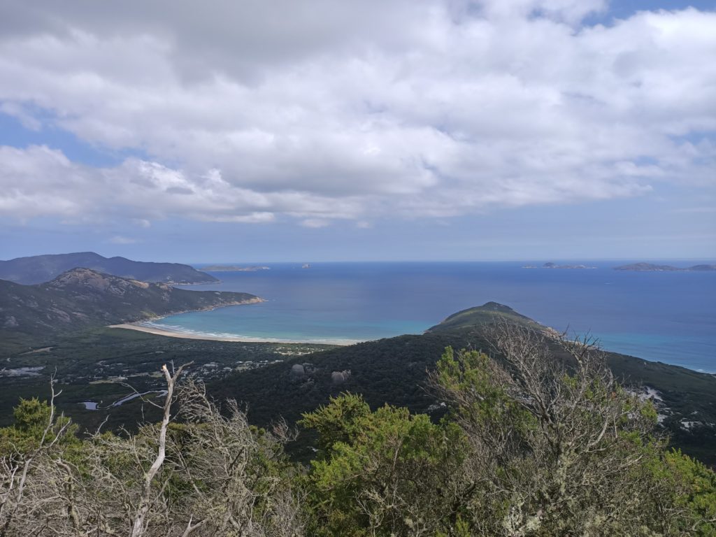 Mount Bishop Summit - looking out at the coastline. You can see the ocean and cloudy skies.