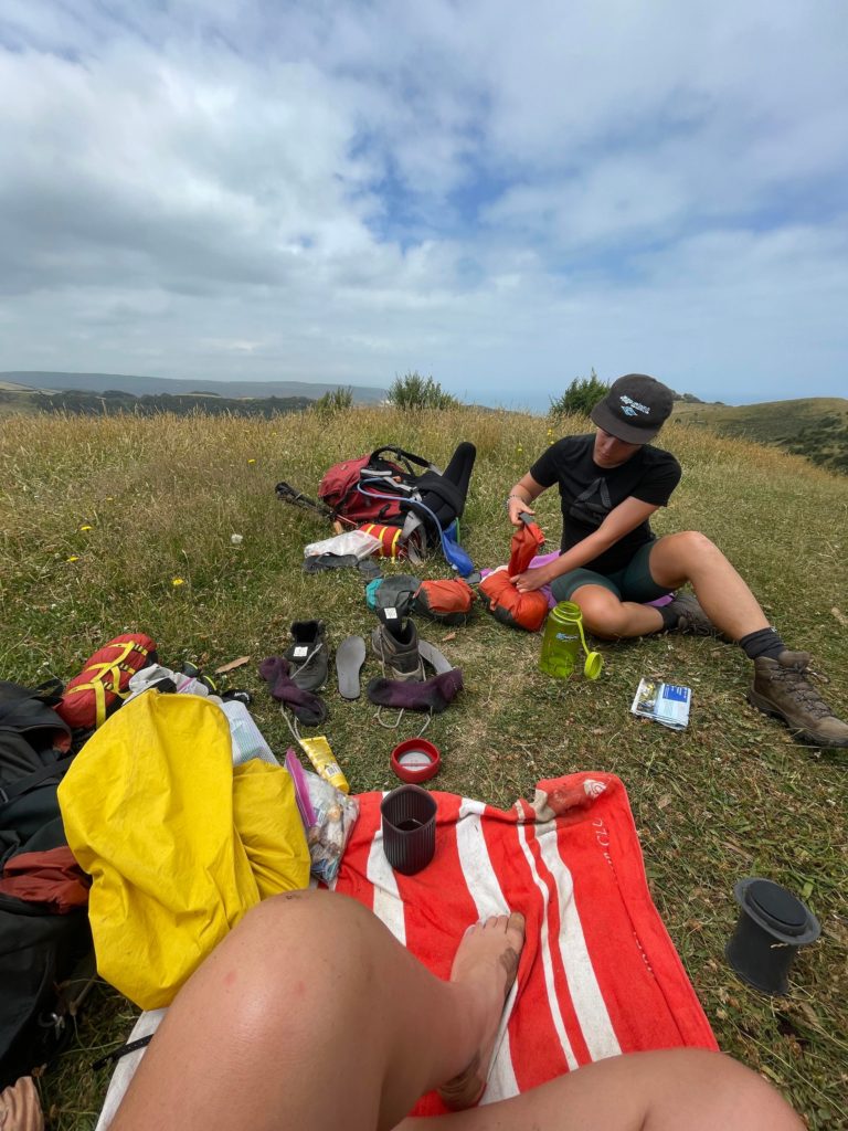 Picnic on a grassy hill.