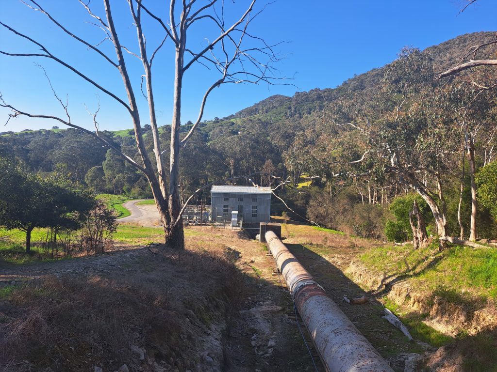 A view from the bridge above the Lower Rubicon Power Station, and the pipeline going down towards it.